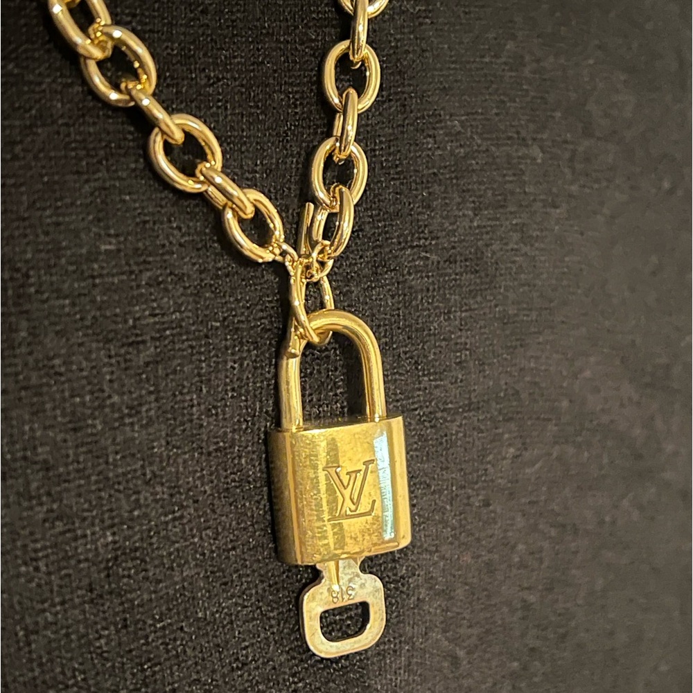 Louis Vuitton Lock and Key with 18k gold  plated toggle bar clasp necklace.